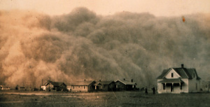 A dust storm envelops houses in Stratford, Texas, 1935. These massive storms, called ‘black blizzards’ or ‘black rollers,’ could reduce visibly to just a few feet.