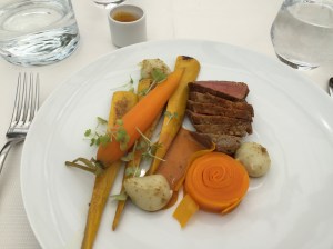 Beef eye-of-round and Carrots cooked in mild  " ices (Voatsiperifery  pepper, paprika and turmeric), cumin potato bubbles and sa % ron  yellow zucchini, beef gravy and cress shoots to 